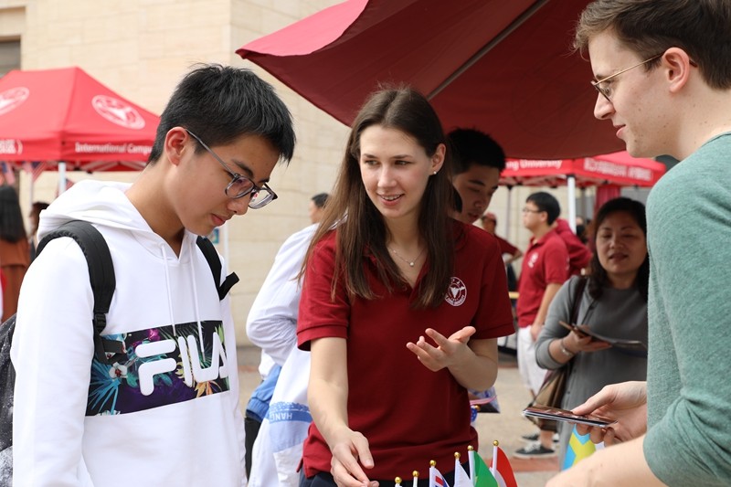 Students showing guests their stalls